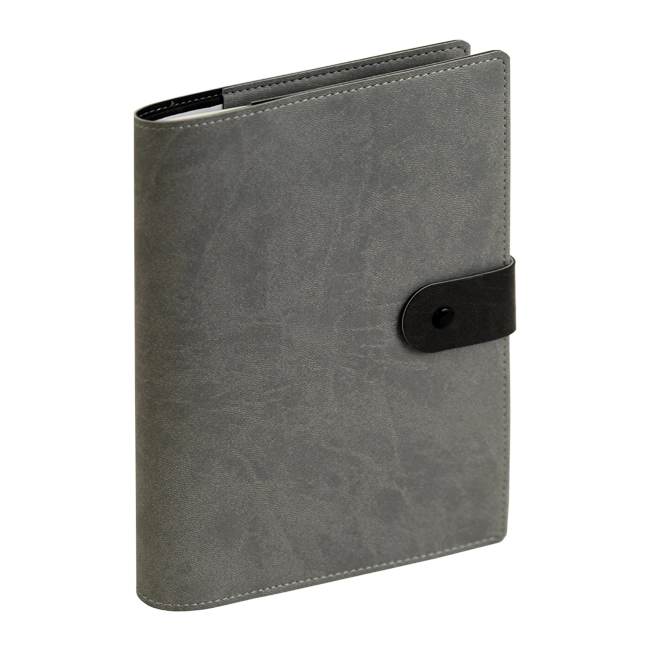 Agenda Reflexa chiusa con copertina grigia su sfondo neutro